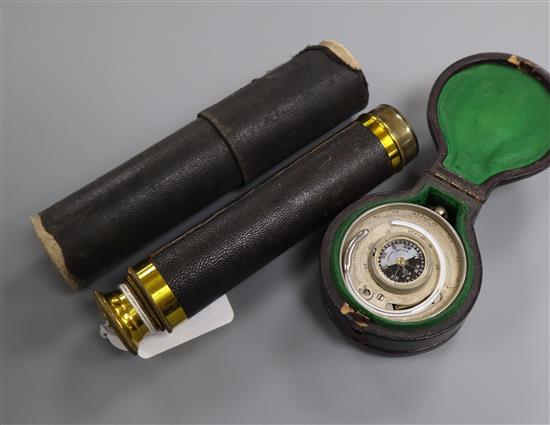 A pocket barometer, thermometer and compass in leather case and a gilt brass three-draw telescope telescope 14.5cm long (closed)
